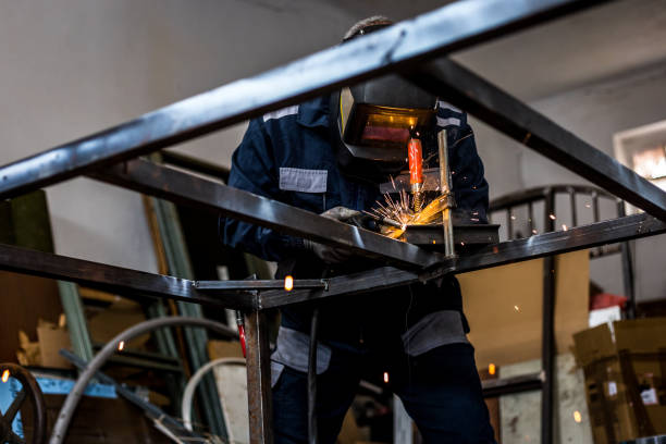 istock Senior man welding garage doors 1252878945