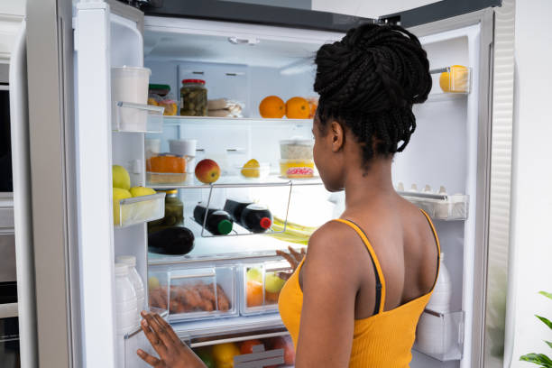 istock African American Woman Near Open Refrigerator 1252880906