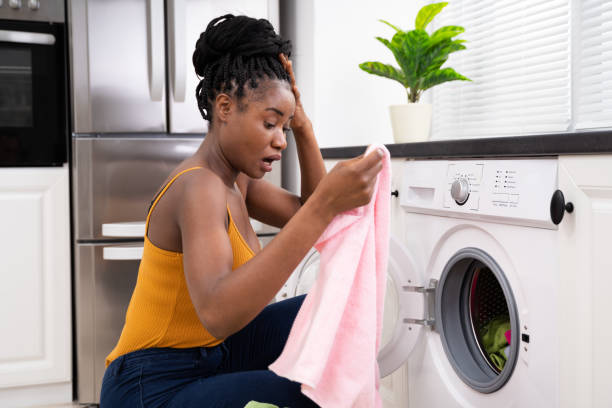 istock Woman Washing Clothes 1252880951