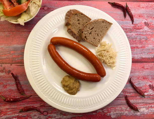 istock Sausages with mustard, bread and fresh horseradish. 1252880989