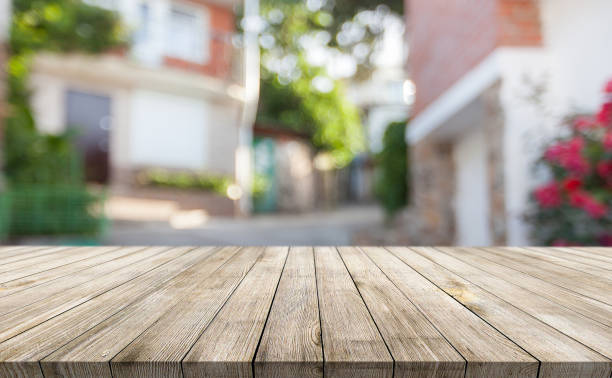 istock Wooden desk on bokeh blur abstract natural background 1252884265