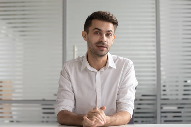 istock Concentrated male hr manager holding video distant job interview. 1252884658