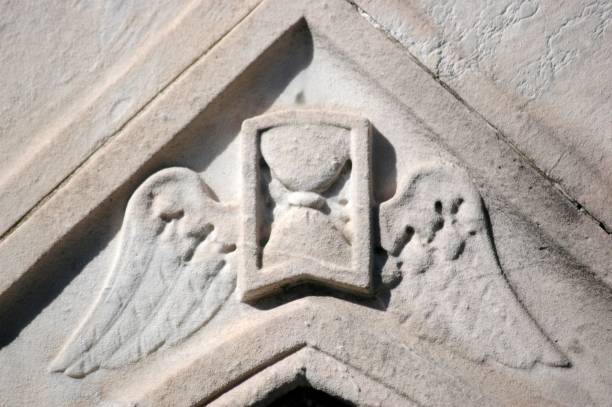 istock Sculpure of Angel Wings on Rock Wall 1252887881