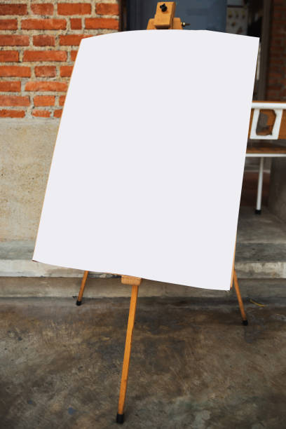 istock Blank paper on easel in front of coffee shop 1252888193