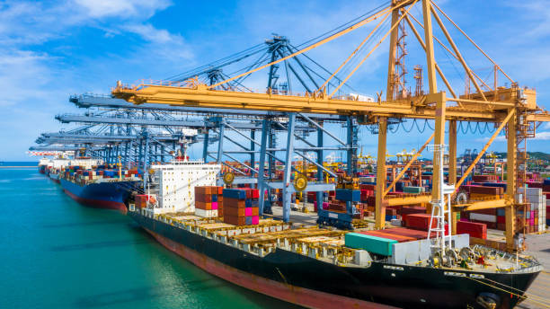 istock Aerial view container cargo ship, import export commerce global business trade logistic and transportation of International by container cargo ship boat, Freight shipping maritime sea port terminal. 1252890093