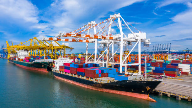 istock Aerial view container cargo ship, import export commerce global business trade logistic and transportation of International by container cargo ship boat, Freight shipping maritime sea port terminal. 1252890097