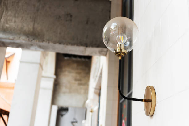 istock Retro style lamp hanging on wall 1252890295
