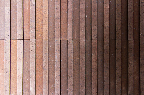 istock Orange and uneven brown brick 1252890773