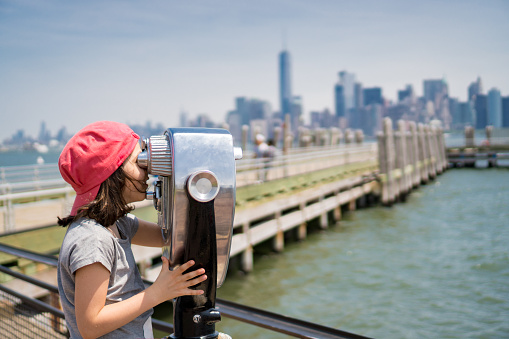 Child looking at panorama from Liberty Island