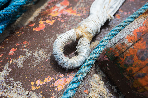 Details of a fishing boat. Nylon ropes. Sailor's knot.