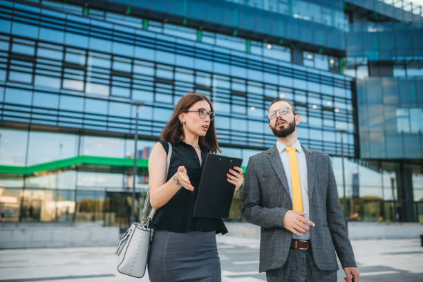 istock Colleagues in front of the office building 1252895346