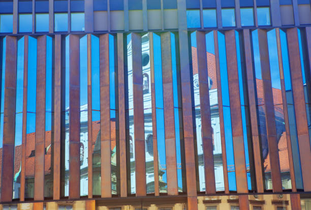 Reflection of orthodox church in facade of modern business building on Preradovic square (Flower square)