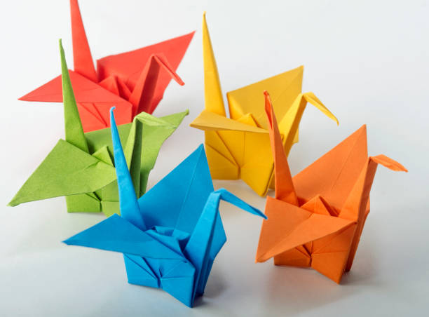 istock Colorful origami Crane bird dancing in raw 1252902144
