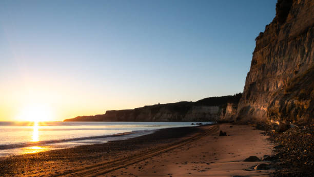 istock Beautiful beach sunrise shot during coastal hike 1252902238