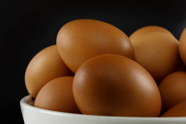 istock Close up fresh chicken eggs on linen tablecloth and white table with copy space . 1252903362