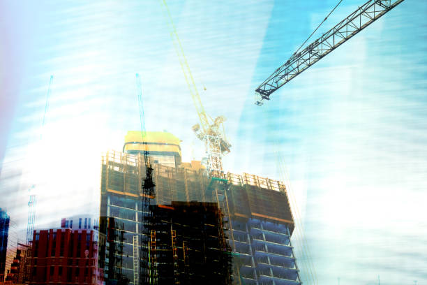 istock Investment and Construction. High buildings and cranes. 1252905074