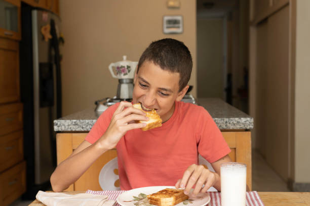 istock Boy about to eat a sandwich 1252907108
