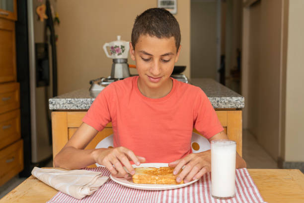 istock Boy about to eat a sandwich 1252907198