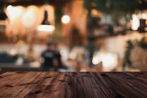 istock Wooden table on a restaurant blurred background is an abstract background 1252907942