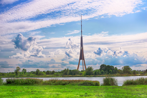 View of Riga Radio and TV Tower and cloudy sky in Riga, Latvia. It is the tallest tower in the European Union