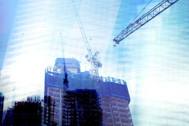 istock Investment and Construction. High buildings and cranes. 1252909235