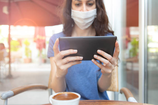 istock Woman with face protective mask 1252910383