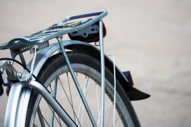 istock Rear wheel and bike rack on road background 1252910603