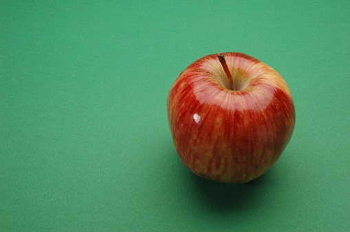 Red Apple, Close Up on green background