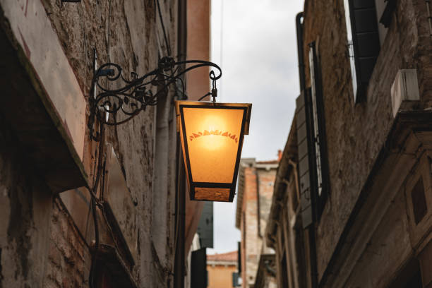 istock Venice alley lamp, warm yellow, horizontal orientation. 1252916738