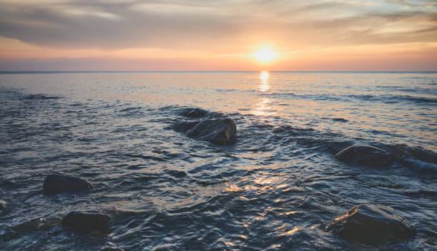 istock Seascape with rocks in water at sunset. 1252918816
