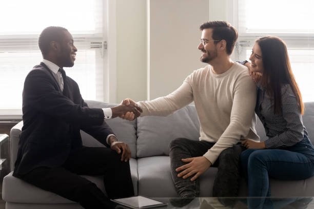 istock Couple purchasing realty feels satisfied shake hands thanking financial advisor 1252926476
