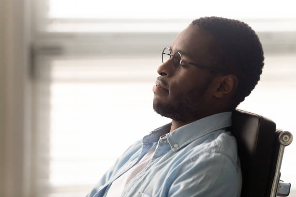 istock African worker resting seated on ergonomic office chair at workplace 1252926540