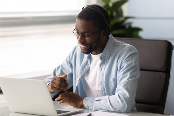 istock African telemarketer using headset answers incoming calls sell products 1252926596