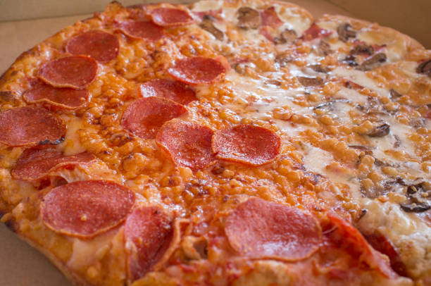 istock Delicious fresh made pepperoni pizza on cardboard box 1252937705