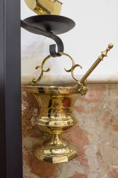 istock Aspersorium or holy water bucket, also known as a situla with aspergillum 1252937721