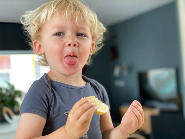 Lemon Eating Child Sour Taste Stock Photos, Pictures & Royalty-Free Images - iStock