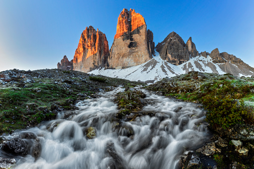 Mountain stream with melt water that comes from the Tre Cime