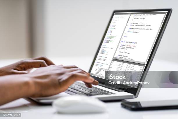 Software Developer Writing Computer Code Stock Photo - Download Image Now - Debugging, Adult, Adults Only