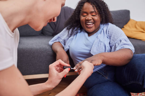 istock Charming positive lady enjoying manicure process at home 1252944035