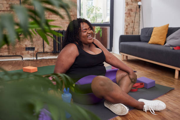 istock Delighted afro american lady getting a rest on yoga mat 1252944087