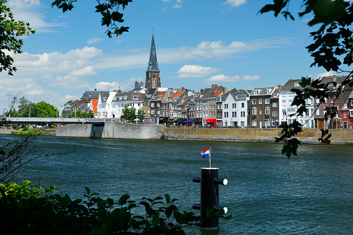 This aerial drone photo shows the Nieuwe Toren in Kampen, Overijssel. It is a large clock tower in the old city centre of Kampen.