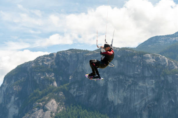 istock Man kiteboarding along the coast 1252946242