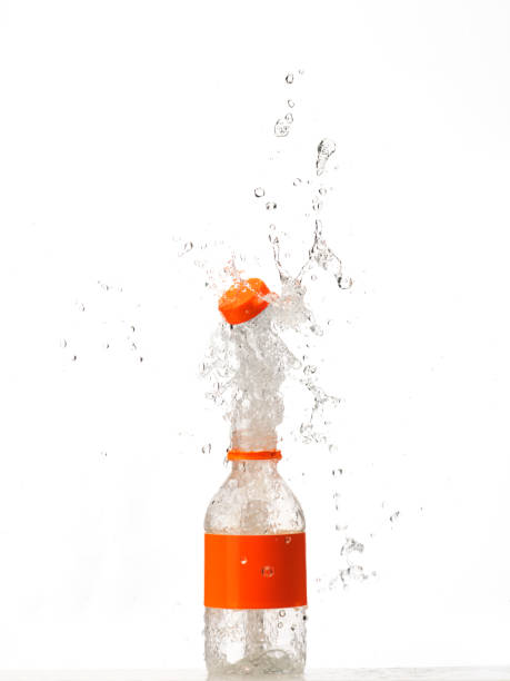 Water in glass bottle splashing