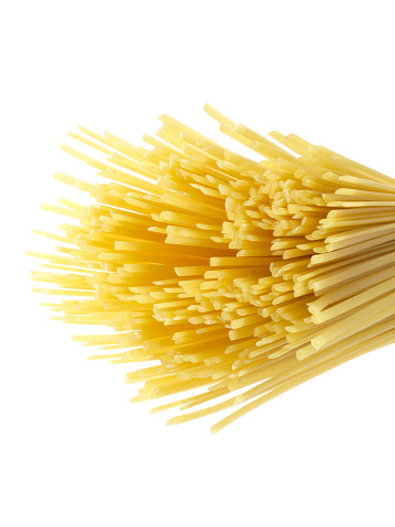 uncooked spaghetti isolated on white background. Selective focus image