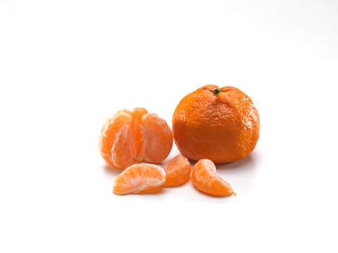 Tangerine or clementine isolated on white background.