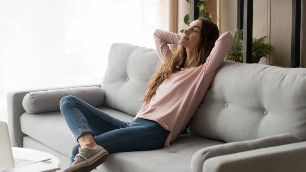 istock Young freelance woman taking a rest during remote work day. 1252949331