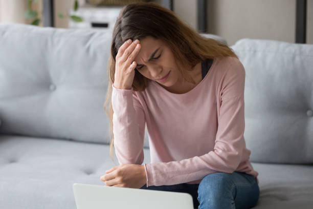 istock Stressed exhausted upset millennial woman suffering from sudden head ache. 1252949345
