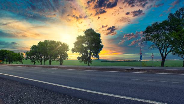 istock highway goes to the horizon between the fields 1252949599