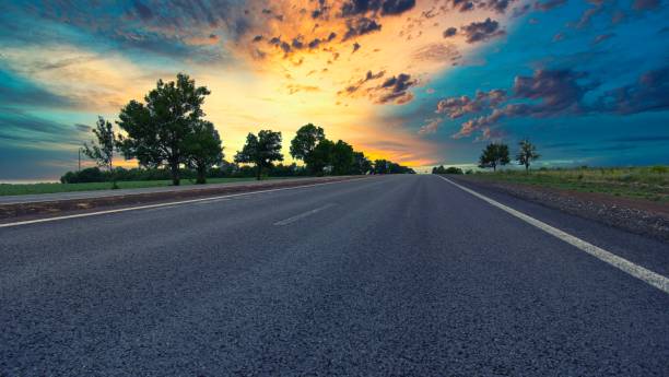 istock highway goes to the horizon between the fields 1252949619