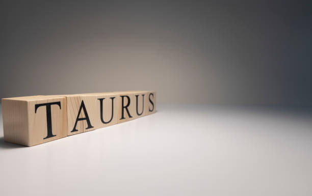 istock Taurus word on wooden cubes on white background. 1252954742